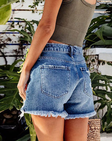 DISTRESSED TASSEL DENIM SHORTS